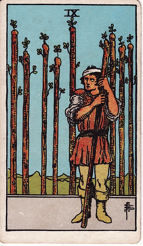 Nine Of Wands Tarot Card: Upright, Reversed & Spread Meanings — Rider-Waite-Smith tarot card
